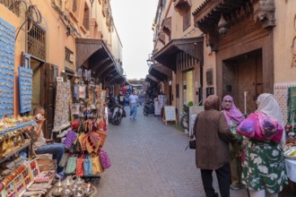 Lively market alleyway with lots of shops and souvenirs in a narrow alley