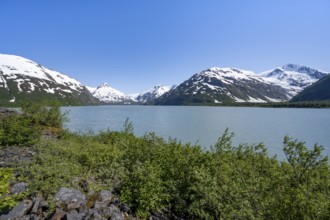 View of mountains with Portage Glacier glacier and turquoise glacial lake Portage Lake, Chugach