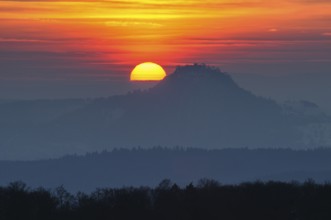 The distinctive silhouette of the Hohentwiel Hegau volcano at sunset, Konstanz district,