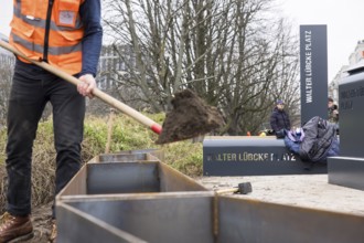 Workers erect the Walter Lübcke Square in front of the Konrad Adenauer Haus, the party headquarters