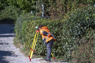 Land surveyor at work, Ahrenshoop, Darß, Mecklenburg-Western Pomerania, Germany