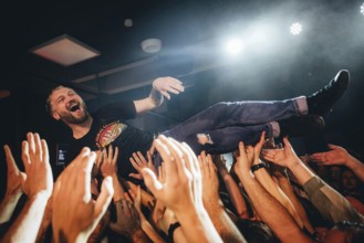 Billy Lunn, singer and guitarist from The Subways, crowd-surfing the fans live on For Eternity Tour