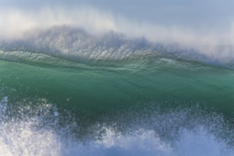 Perfectly constructed wave with turquoise colored sea water. Byron Bay, New South Wales, Australia