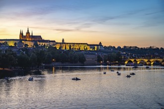 Sunset over the Vltava River, Charles Bridge and Prague Castle in Prague, Czech Republic