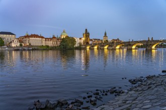 Old Town of Prague with Vltava River, Charles Bridge and Old Town Bridge Tower at dusk, Prague,