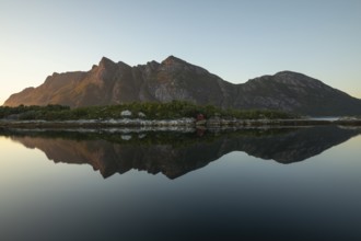 Sunset over Festvåg near Bodø. Reflection of mountains in the fjord