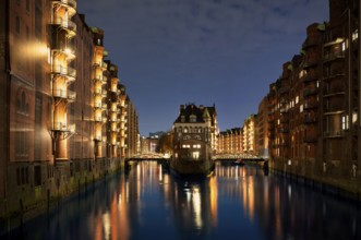 Night view, historic moated castle, warehouses, brick buildings, canal, Hamburger Speicherstadt,
