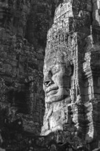 Huge stone-carved face of Bodhisattva Lokeshvara, also Avalokiteshvara, Bayon Temple, Angkor Thom,