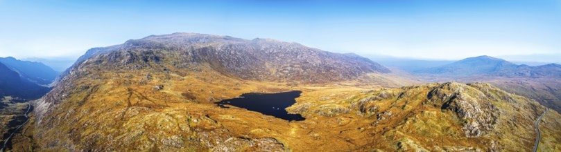 Autumn colours over Llyn Cwmffynnon and Miner's Track, Start Point, road A4086 from a drone,