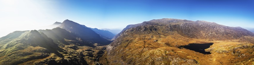 Autumn colours of Pen-y-Pass over Miner's Track, Start Point and road A4086 from a drone,