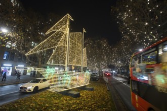 The Kurfürstendamm in western Berlin with Christmas lights and several light installations, such as