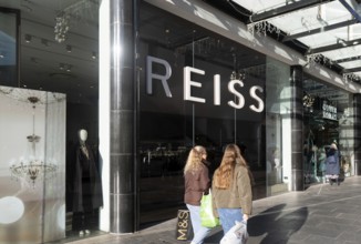 Shoppers walking past Reiss shop store in city centre, Princesshay, Exeter, Devon, England, UK