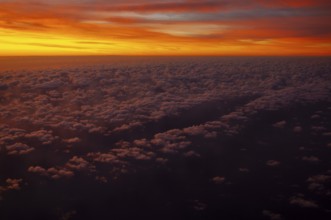 View from airplane window at sunrise