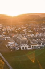 Aerial view of a modern built village in the evening light, Althengstett, Calw district, Germany