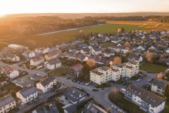 Aerial village with settlements and fields in evening autumn light, Althengstett, Calw district,