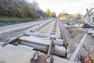 Long rectilinear tracks on a construction site in an autumn landscape, track construction of the