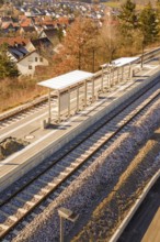 Station with platform and tracks in rural surroundings, surrounded by autumn landscape, new Hermann