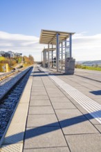 Spacious railway platform with panoramic views of nature and sun, new Hermann Hessebahn railway
