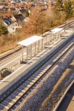 Detailed view of the covered platform of a small train station with tracks, new Hermann Hessebahn