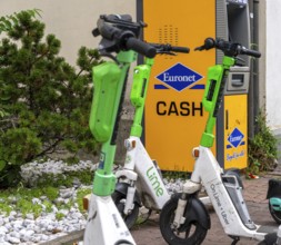 Electric scooters and rental bikes on public roads, Berlin, Germany