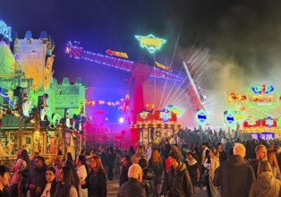 Many people at the All Saints Fair at night, the biggest old town fair in Europe, Soest, North