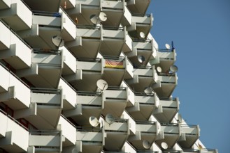 High-rise apartment building with balconies and satellite dishes, satellite town of Chorweiler in