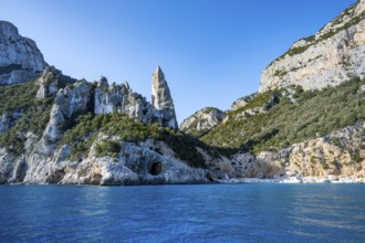 Picturesque rocky coast, cliffs with L'Aguglia pinnacle, blue sea and Cala Goloritzé beach, Golfo