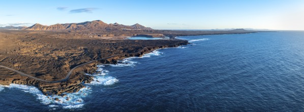 Coast with lava fields, volcanic landscape near Los Hervideros, in the evening light, aerial view,