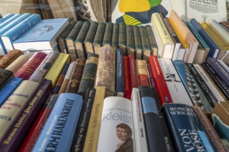 Table with partly old books, offered by a second-hand bookshop