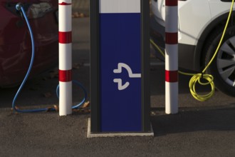 Parking lot with gas pump, EnBW charging station for electric cars, charging station, e-charging