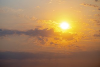 Dramatic sunset with clouds and sun, Etosha National Park, Namibia