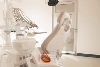 Modern dental clinic interior with equipment and patient chair ready for treatment