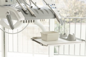 Dental equipment, doctor's unit, module, in a bright clinic, with modern technology, no people,