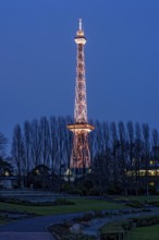 Red illuminated Berlin radio tower, half-timbered steel building by architect Heinrich Straumer,