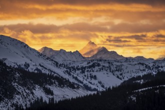 Grossglockner peaks at sunset in winter, spectacular cloudy skies, Hochbrixen, Brixen im Thale,