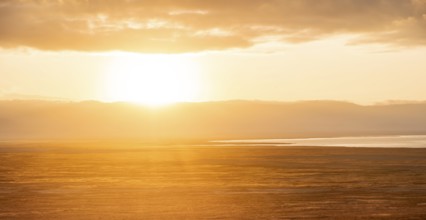 View of savanna landscape at sunrise, atmospheric morning light, view of Ngorongoro Crater, back