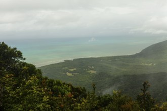 Distant tropical view from Mount Sorrow across valley and bay to where the Great Barrier Reef meets
