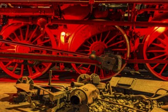 Illuminated wheelwork of a historic locomotive, railway museum, Augsburg railway park,
