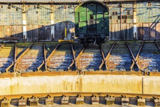 Historic railroad car parked in front of the old engine shed, Augsburg railway park, administrative