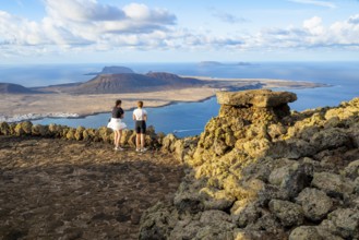 Tourists on the viewing platform at the Mirador del Río viewpoint, in the evening light, view of