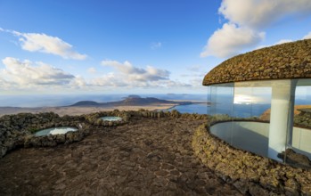 Stairway and viewing platform at the Mirador del Río viewpoint, in the evening light with sun