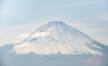 Snow-covered summit of Mount Fuji volcano in spring, Owakudani, Hakone, Japan
