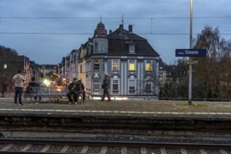 Essen-Steele S-Bahn station, passengers waiting for the train late afternoon, in autumn, Essen,