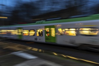 S-Bahn train on the way, at Essen-Steele tram station, North Rhine-Westphalia, Germany