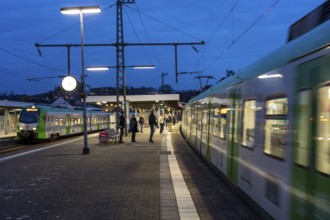 Essen-Steele S-Bahn station, passengers waiting for the train late afternoon, in autumn, Essen,