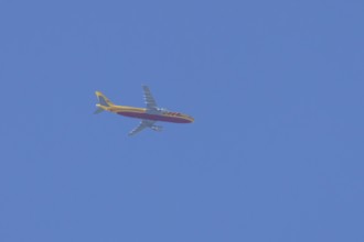 Boeing 767 jet cargo aircraft of DHL airlines flying in a blue sky, England, United Kingdom