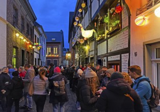 People on the Alte Schulstraße decorated for the Martin train in the evening, Old Town, Kempen,