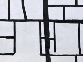 Unusual framework of irregularly arranged rectangular wooden beams in three compartments,