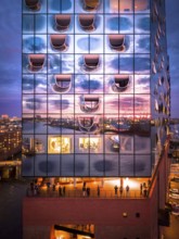Aerial view of the Elbe Philharmonic Hall with reflections on the façade in the evening light above
