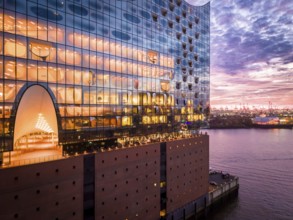 Aerial view of the Elbe Philharmonic Hall with reflections on the façade in the evening light above